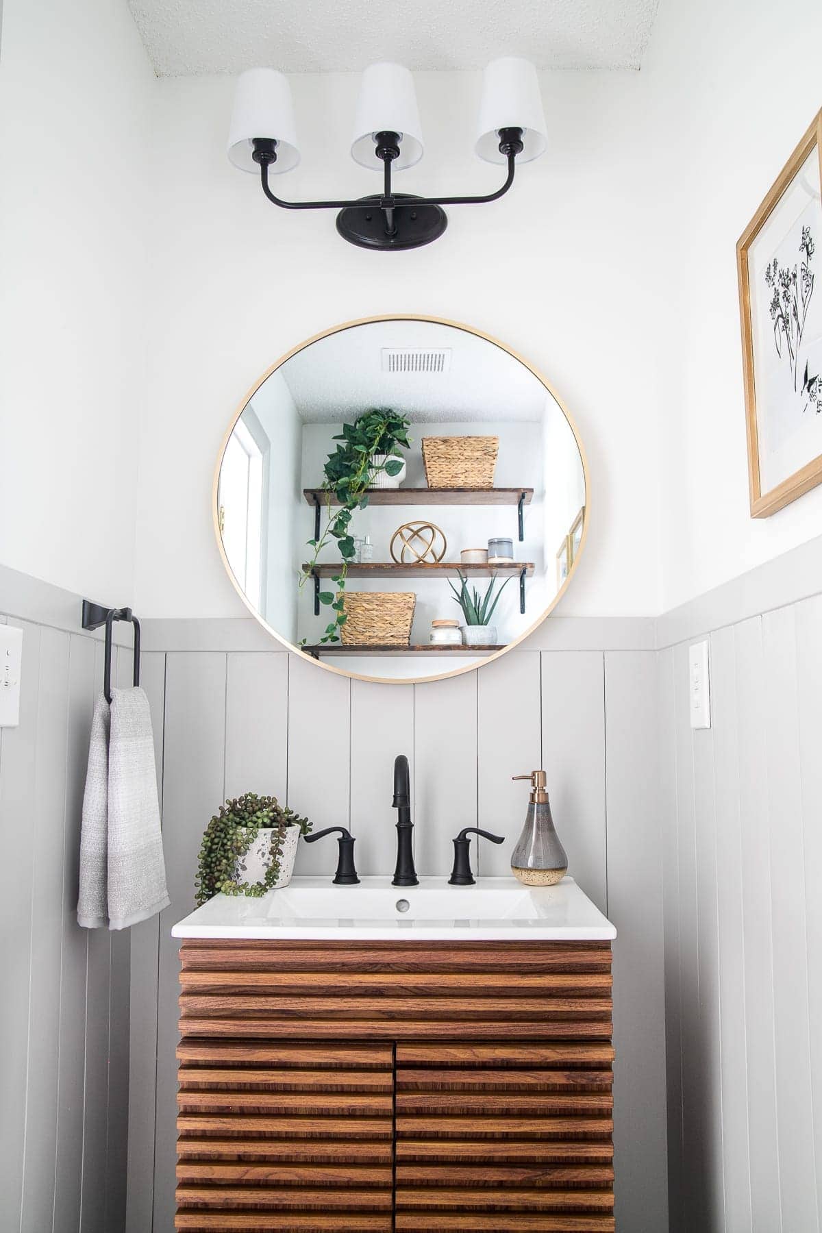gray vertical shiplap with white walls and wood vanity in a bathroom - wall molding