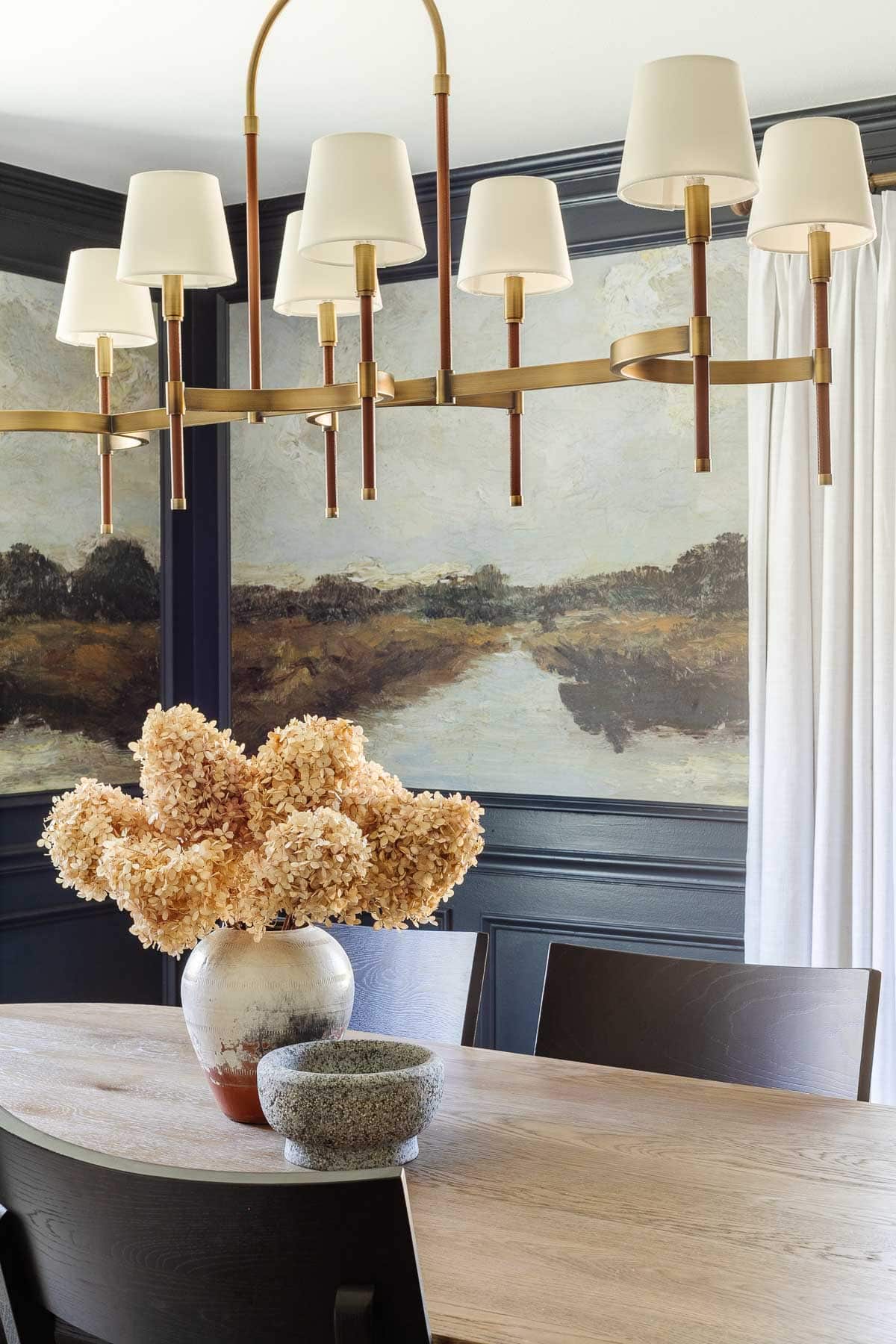 simple vase of dried hydrangeas on a dining room table