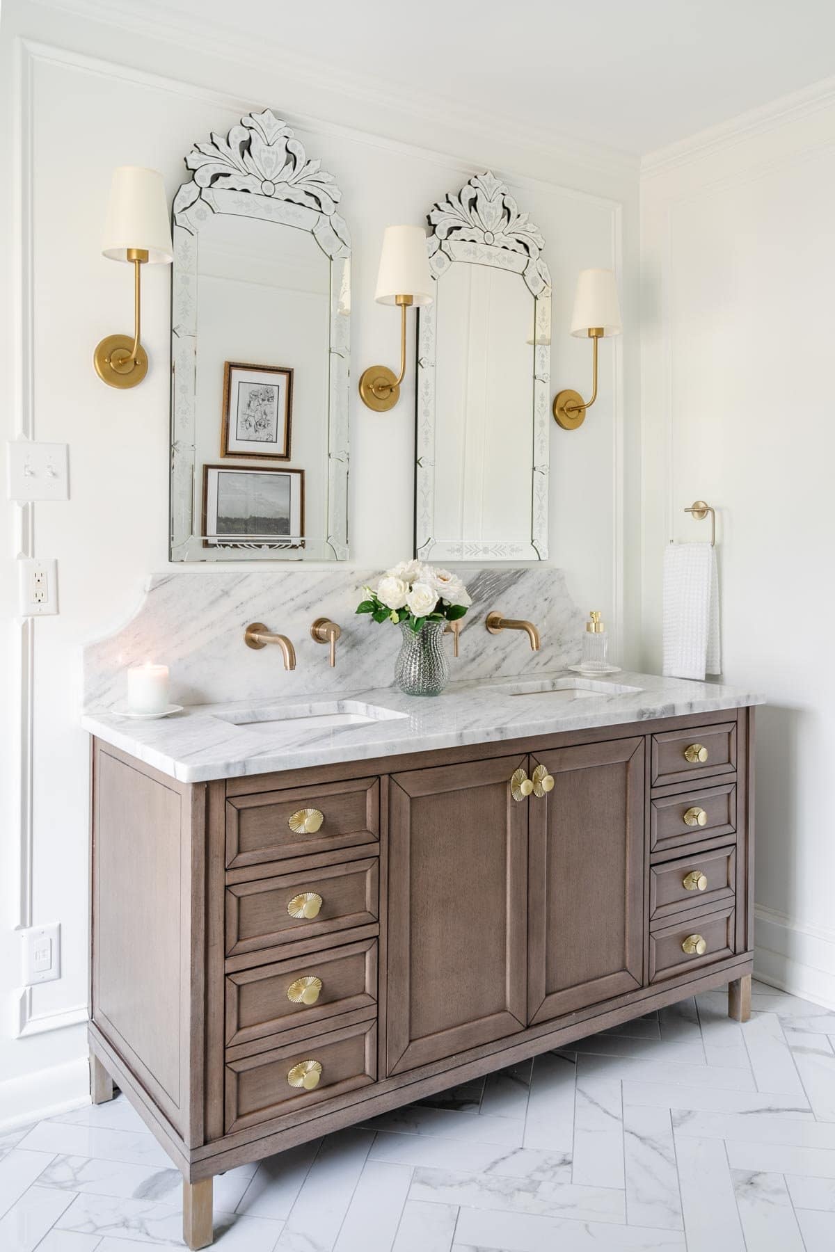 French inspired master bathroom remodel with marble countertop and herringbone tile