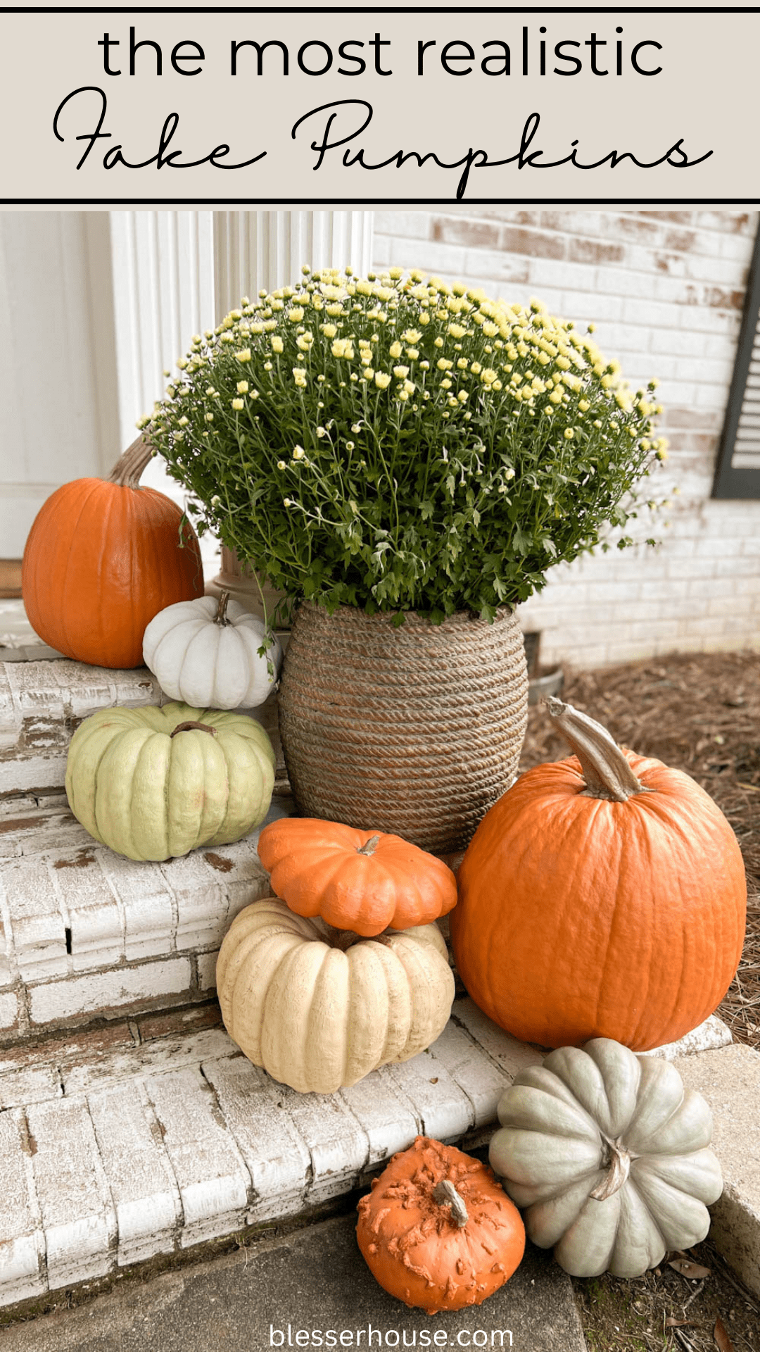 planter of mums and realistic pumpkins on porch