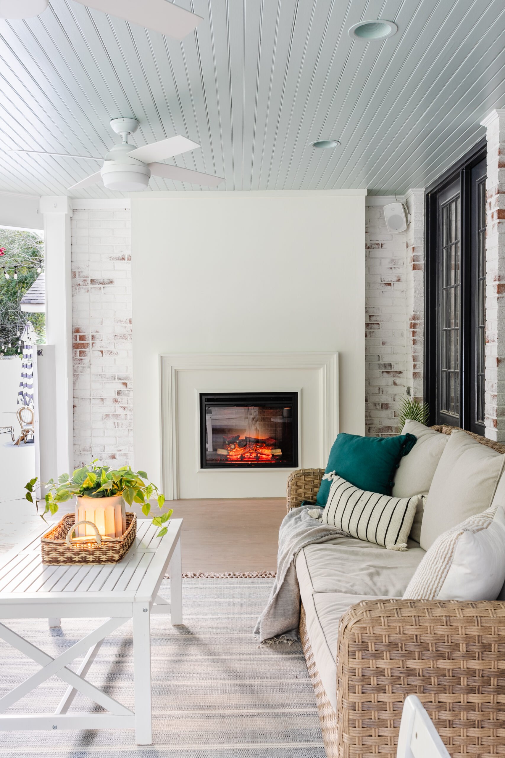 easy diy plaster fireplace with electric insert on a porch